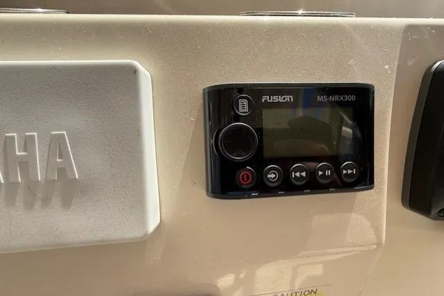 Slide: The Image of Control panel on 2018 Grady-White Freedom 325 boat featuring Fusion MS-NRX300. - 39