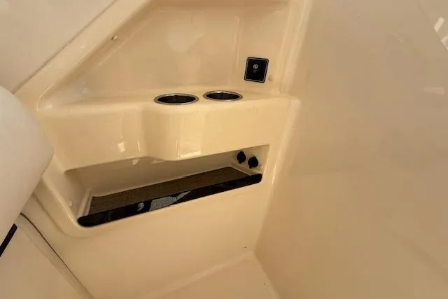Slide: The Image of Interior of 2018 Grady-White Freedom 325 boat with cup holders and storage compartment. - 41