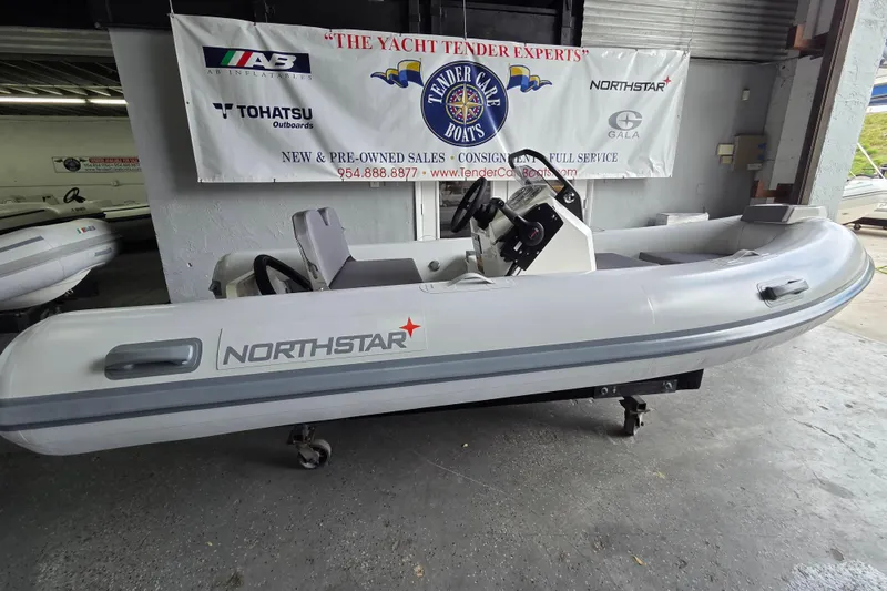 The Image of 2026 Northstar Vega 3.8 boat with Tohatsu 30HP engine displayed indoors. - 0
