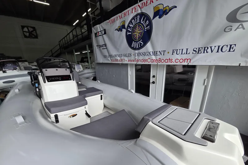 Slide: The Image of 2026 Northstar Vega 3.8 boat with Tohatsu 30HP engine displayed indoors. - 10