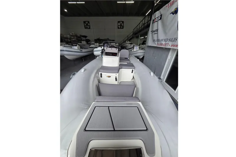 Slide: The Image of 2026 Northstar Vega 3.8 boat with Tohatsu 30HP engine in showroom. - 12
