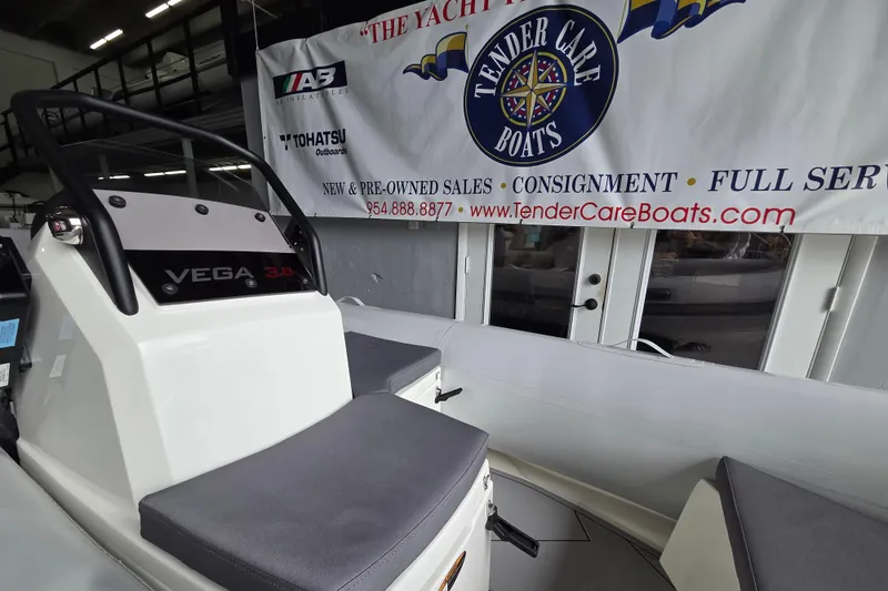Slide: The Image of 2026 Northstar Vega 3.8 boat with Tohatsu 30HP engine at Tender Care Boats showroom. - 13