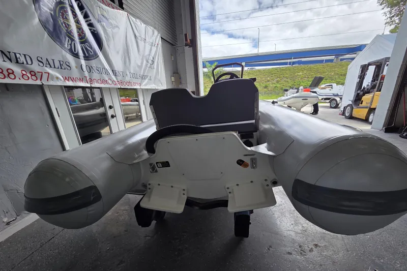 Slide: The Image of 2026 Northstar Vega 3.8 inflatable boat with Tohatsu 30HP engine in showroom. - 8