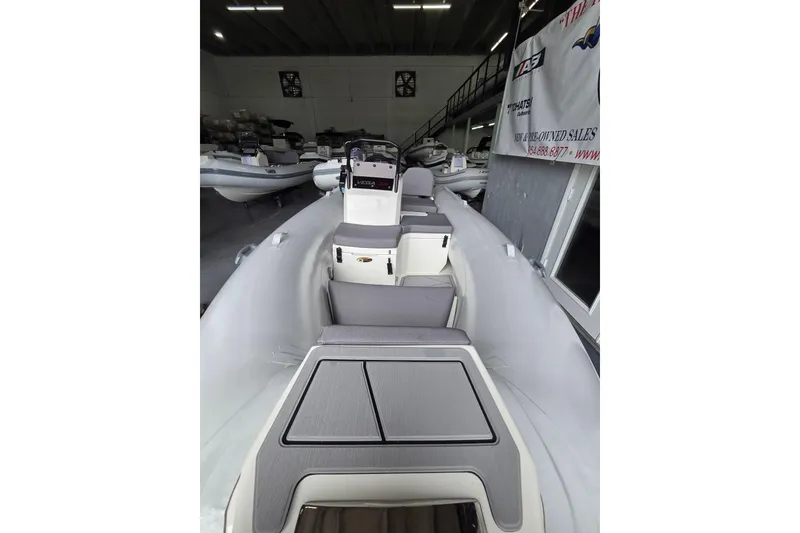 Slide: The Image of 2026 Northstar Vega 3.8 boat with Yamaha 25HP engine in showroom. - 5