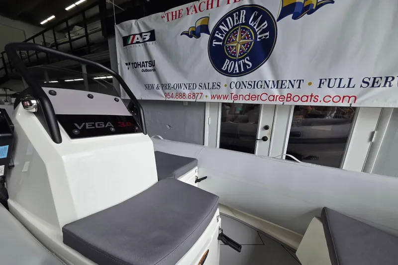 Slide: The Image of 2026 Northstar Vega 3.8 boat with Yamaha 25HP engine at Tender Care Boats showroom. - 6