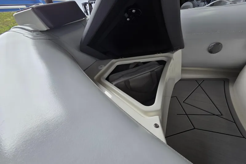 Slide: The Image of Interior view of 2026 Northstar Vega 3.8 boat with storage compartment open. - 7