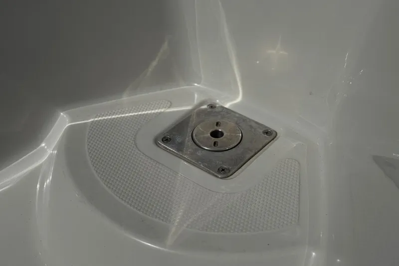 Slide: The Image of Close-up of a 2016 Tahoe 550 TF boat's metal fixture on a textured surface. - 10