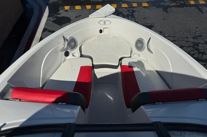 Slide: The Image of Interior of 2016 Tahoe 550 TF boat with red and white seating. - 13
