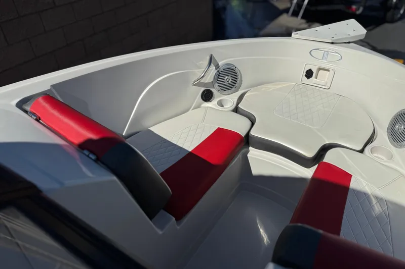 Slide: The Image of Interior of 2016 Tahoe 550 TF boat with red and white seating. - 14