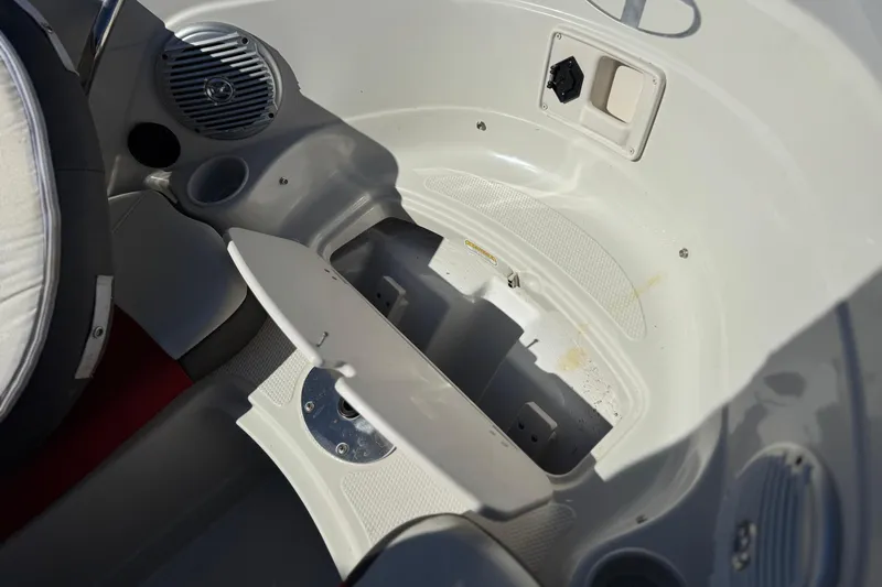 Slide: The Image of Interior view of a 2016 Tahoe 550 TF boat's storage compartment and seating area. - 16