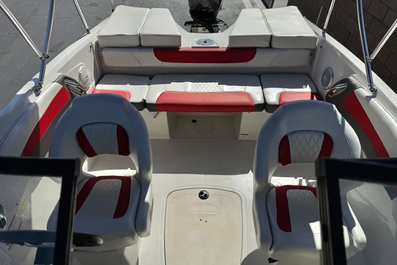 Slide: The Image of 2016 Tahoe 550 TF boat interior with red and white seating arrangement. - 18