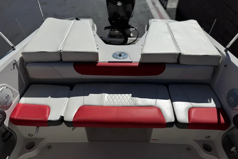 Slide: The Image of 2016 Tahoe 550 TF boat interior with red and white cushioned seating. - 19