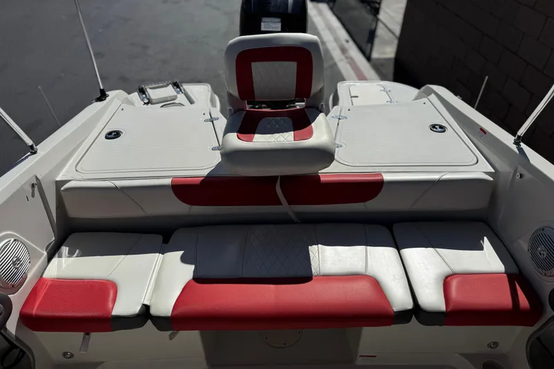 Slide: The Image of 2016 Tahoe 550 TF boat interior with red and white seating, showcasing modern design. - 20