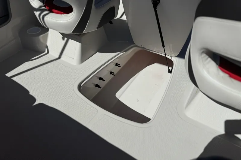 Slide: The Image of 2016 Tahoe 550 TF boat interior with open storage compartment and seating. - 25