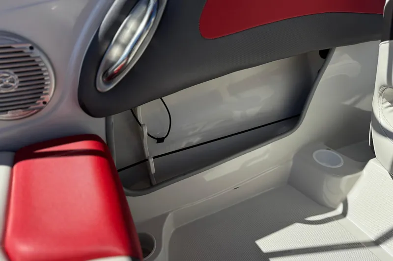 Slide: The Image of Interior of 2016 Tahoe 550 TF boat with red and gray seating. - 26