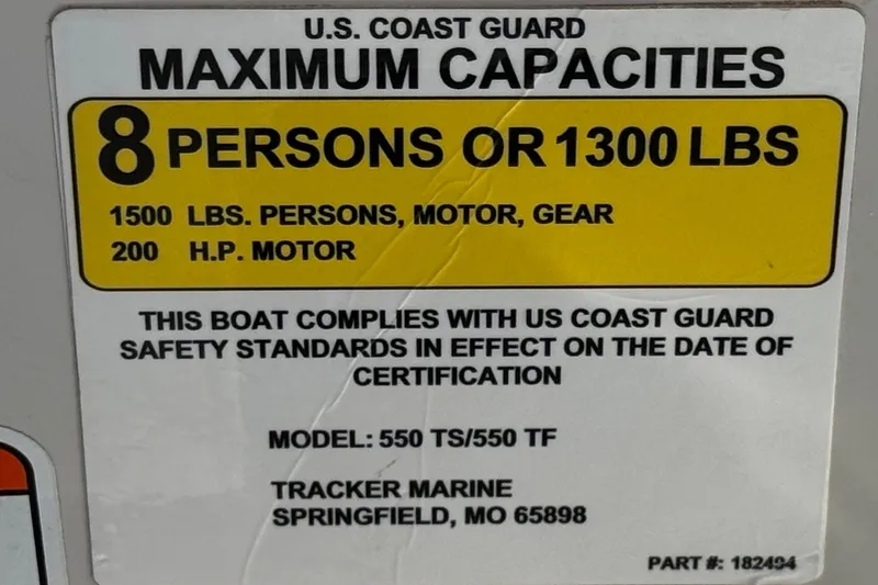 Slide: The Image of U.S. Coast Guard capacity label for 2016 Tahoe 550 TF, 8 persons or 1300 lbs. - 33