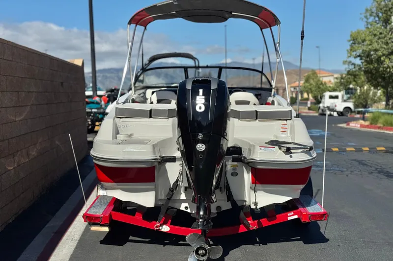 Slide: The Image of 2016 Tahoe 550 TF boat with 150 HP engine on a trailer. - 4
