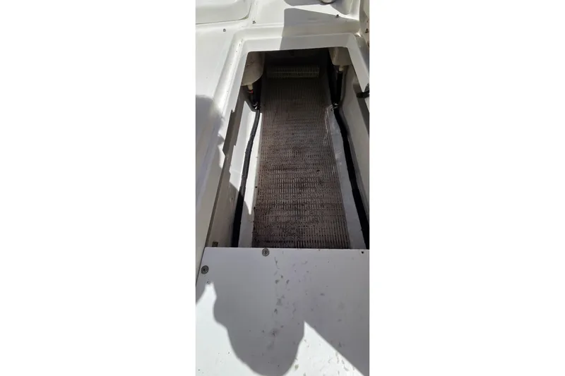 Slide: The Image of Storage compartment of a 2007 Sea Ray SLX 250 boat, featuring a textured floor. - 16
