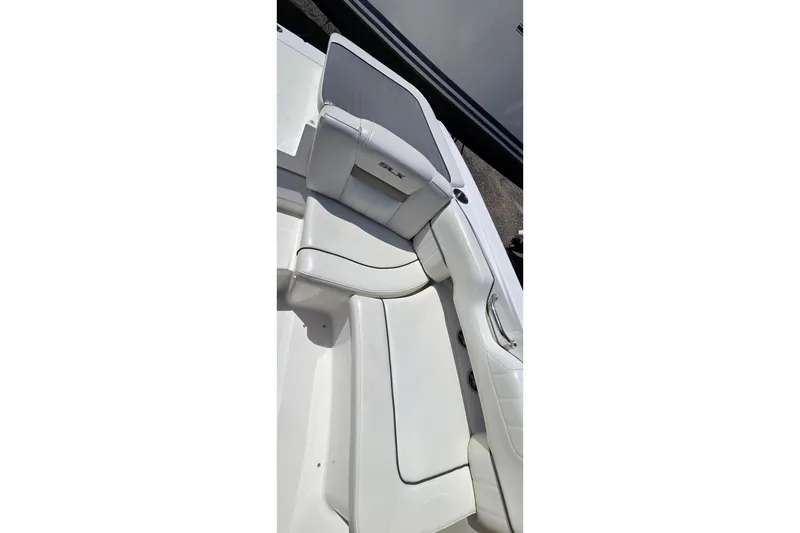 Slide: The Image of 2007 Sea Ray SLX 250 boat interior with white seating and sleek design. - 18