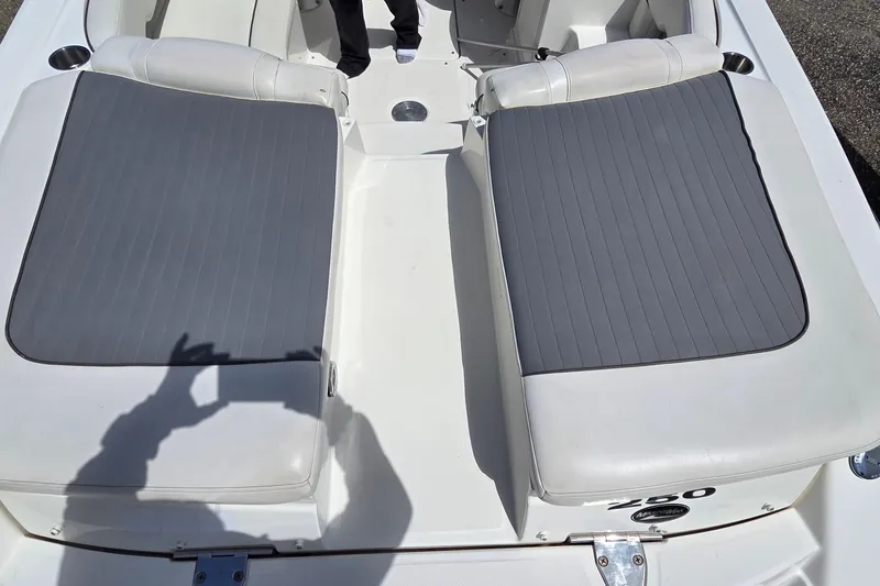 Slide: The Image of 2007 Sea Ray SLX 250 boat interior with gray cushioned seating. - 22