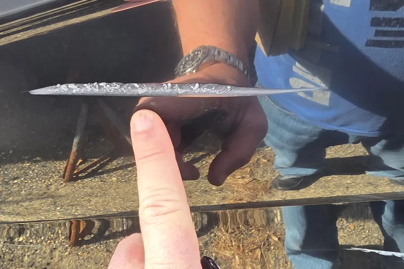 Slide: The Image of Close-up of damage on a 2007 Sea Ray SLX 250 boat hull. - 26