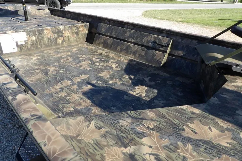Slide: The Image of 2026 Crestliner 1860 Retriever Deluxe boat with camouflage leaf pattern interior. - 10
