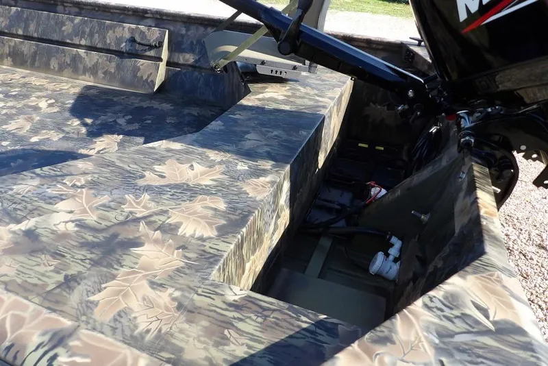 Slide: The Image of 2026 Crestliner 1860 Retriever Deluxe boat with camouflage pattern and motor detail. - 11