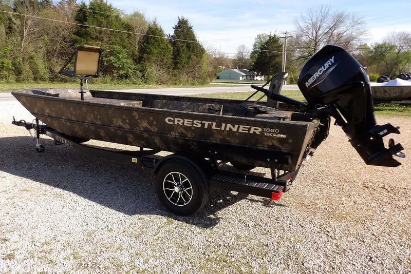 Slide: The Image of 2026 Crestliner 1860 Retriever Deluxe boat with Mercury engine on trailer. - 14