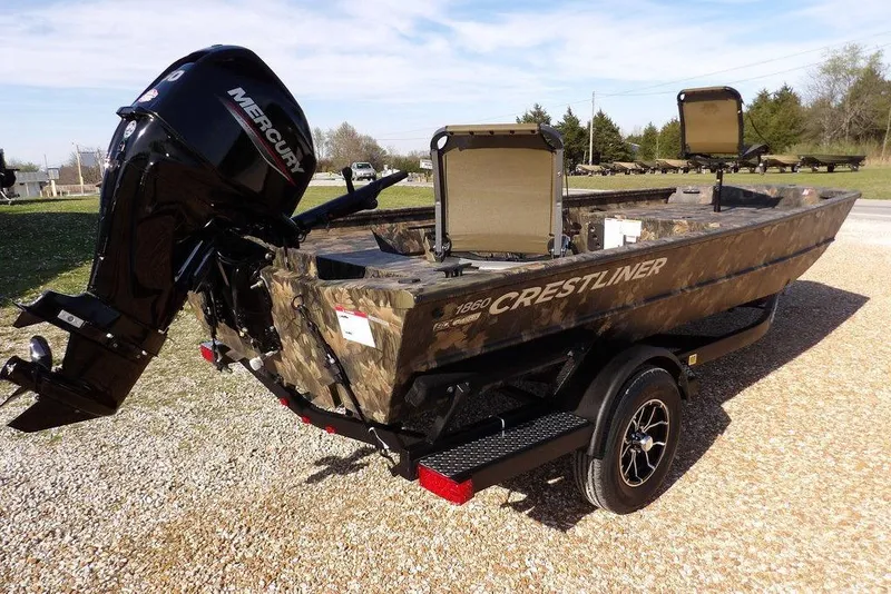 Slide: The Image of 2026 Crestliner 1860 Retriever Deluxe boat with Mercury engine on a trailer. - 17