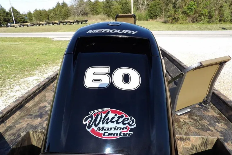 Slide: The Image of 2026 Crestliner 1860 Retriever Deluxe with Mercury engine, featuring "60" and marine center logo. - 19