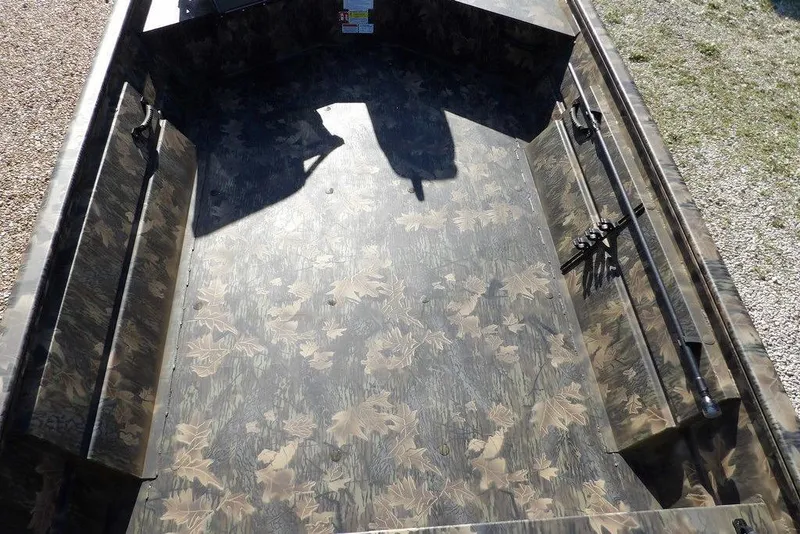Slide: The Image of 2026 Crestliner 1860 Retriever Deluxe boat interior with camouflage pattern flooring. - 20