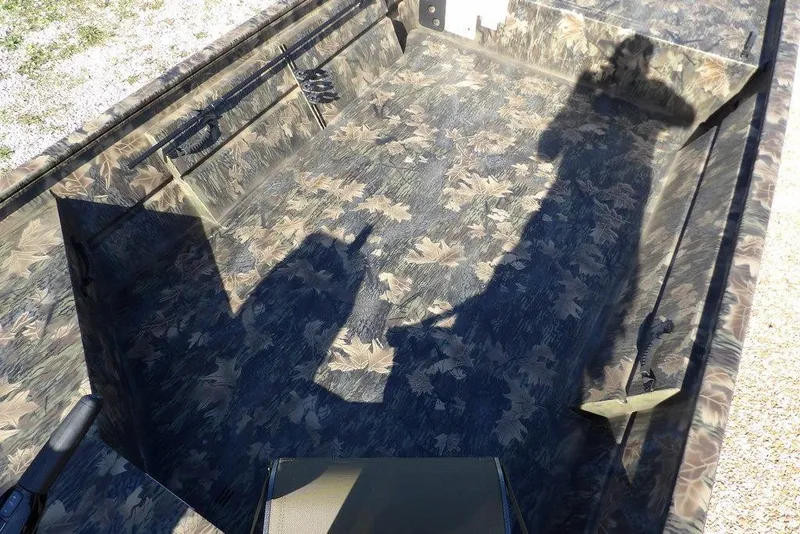 Slide: The Image of 2026 Crestliner 1860 Retriever Deluxe boat interior with camouflage pattern. - 26