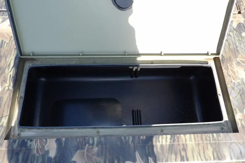 Slide: The Image of Open storage compartment on 2026 Crestliner 1860 Retriever Deluxe boat. - 27