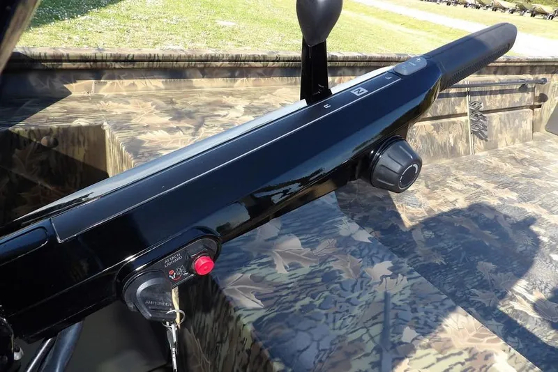 Slide: The Image of 2026 Crestliner 1860 Retriever Deluxe boat control panel with camouflage design. - 33