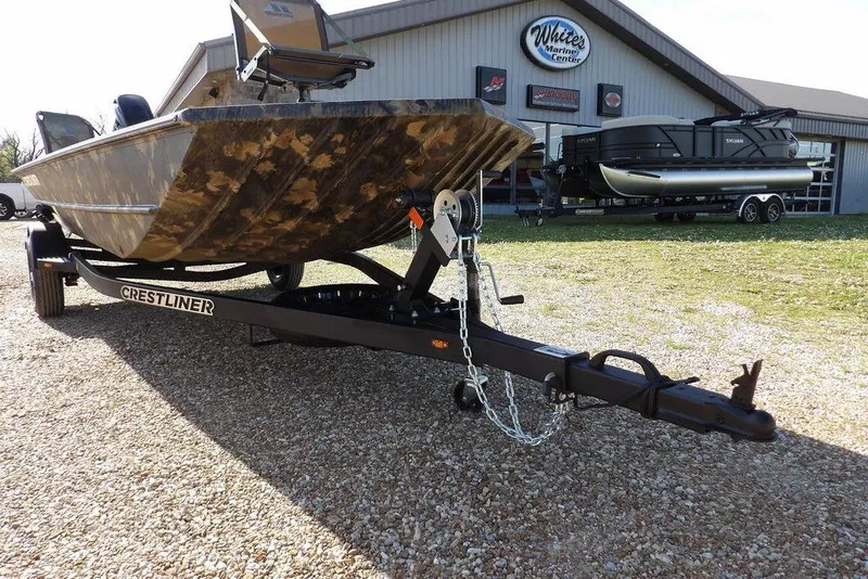 Slide: The Image of 2026 Crestliner 1860 Retriever Deluxe boat on trailer outside marine center. - 34