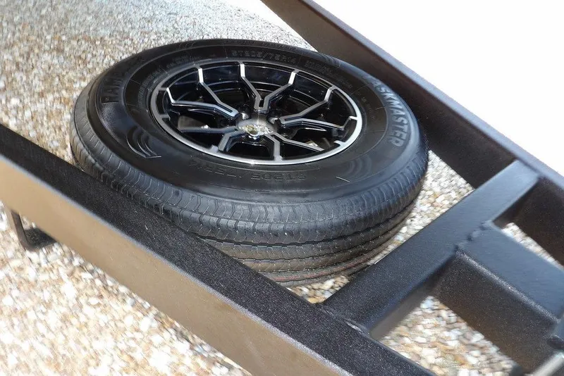 Slide: The Image of Spare tire on Crestliner 1860 Retriever Deluxe trailer, 2026 model. - 35