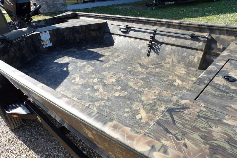 Slide: The Image of 2026 Crestliner 1860 Retriever Deluxe boat with camouflage interior design. - 6