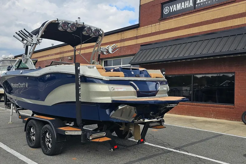Slide: The Image of 2020 MasterCraft X24 boat on trailer outside Yamaha dealership. - 16
