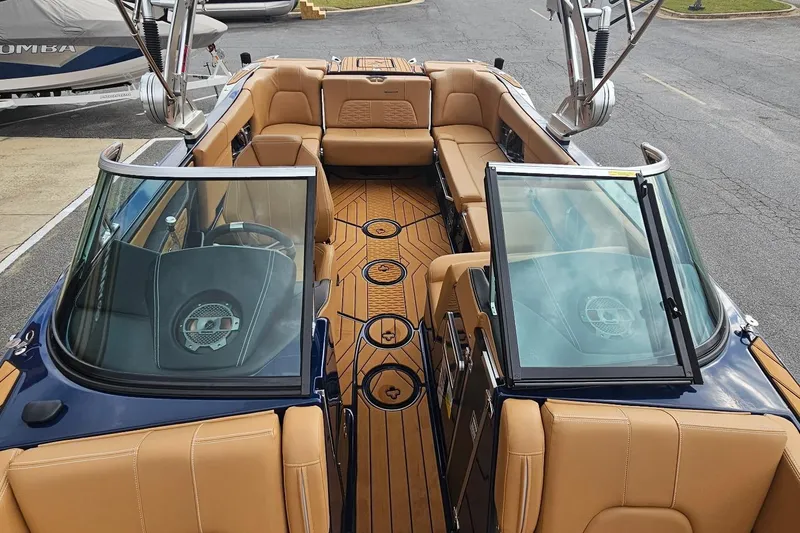 Slide: The Image of 2020 MasterCraft X24 boat interior with tan seating and sleek design. - 23