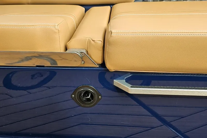 Slide: The Image of 2020 MasterCraft X24 boat with tan upholstery and blue exterior detailing. - 40