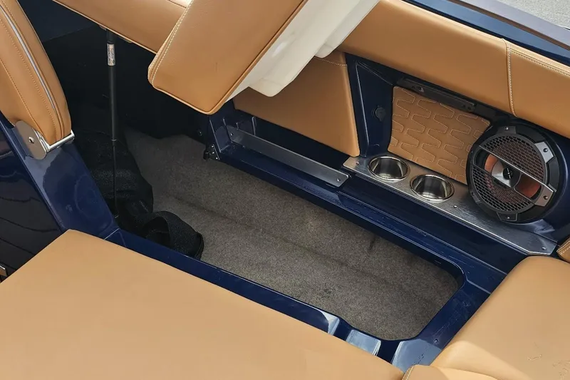 Slide: The Image of Interior of 2020 MasterCraft X24 boat with tan seats and speaker system. - 45