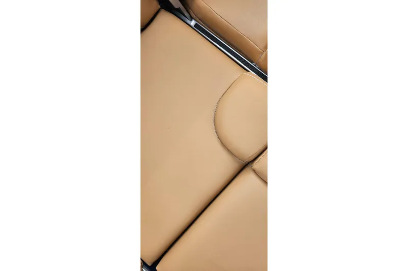 Slide: The Image of Tan leather seating detail in 2020 MasterCraft X24 boat. - 53