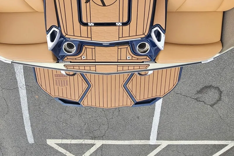 Slide: The Image of Top view of 2020 MasterCraft X24 boat interior with tan seating and custom flooring. - 61