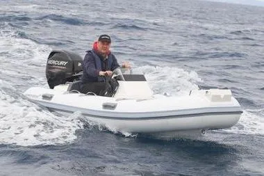 Slide: The Image of 2026 Northstar Vega 3.5 boat with Tohatsu 30HP engine cruising on open water. - 10