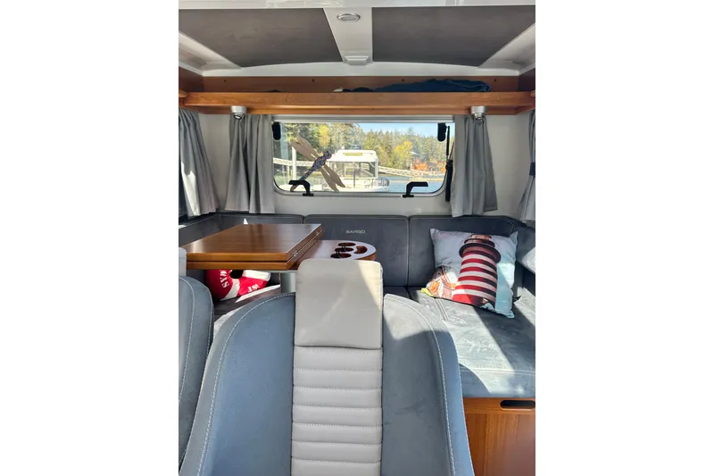 Slide: The Image of Interior of 2018 Sargo 25 boat with cozy seating and nautical decor. - 20