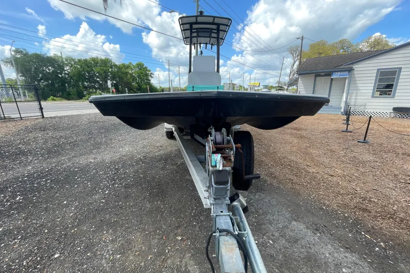 Slide: The Image of 1993 Hurricane FunDeck 196 FF boat on trailer, parked outdoors under a cloudy sky. - 3