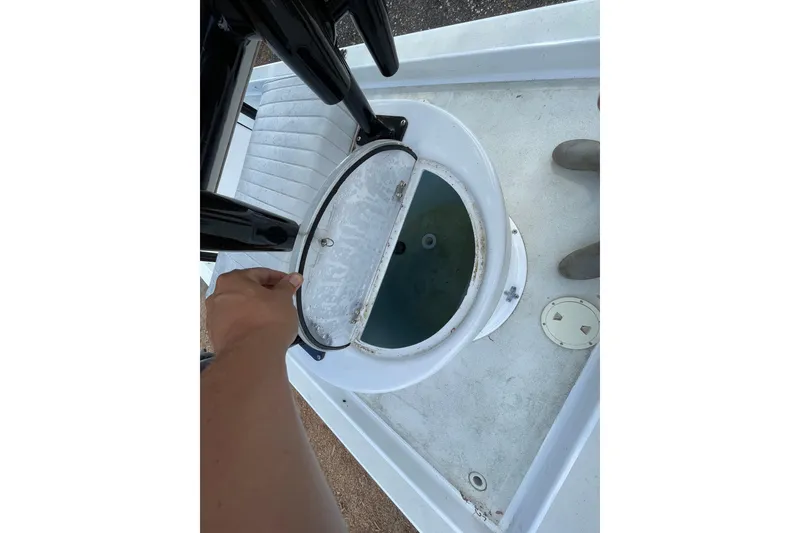 Slide: The Image of 1993 Hurricane FunDeck 196 FF boat livewell with open lid, showing interior details. - 6