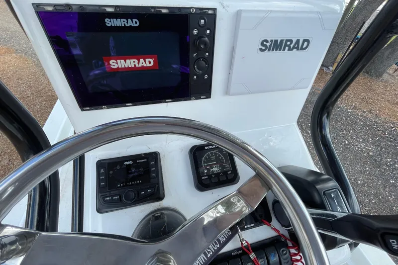 Slide: The Image of Dashboard of a 1993 Hurricane FunDeck 196 FF boat with Simrad electronics. - 8