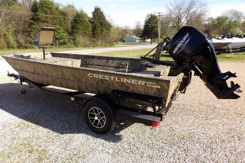 Slide: The Image of 2026 Crestliner 1860 Retriever Deluxe boat with Mercury engine on a trailer. - 10