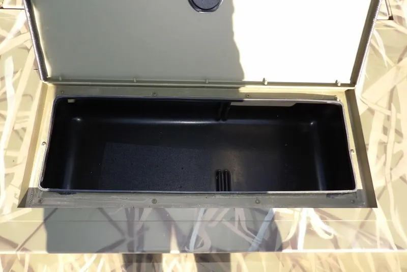 Slide: The Image of Open storage compartment on 2026 Crestliner 1860 Retriever Deluxe boat. - 29